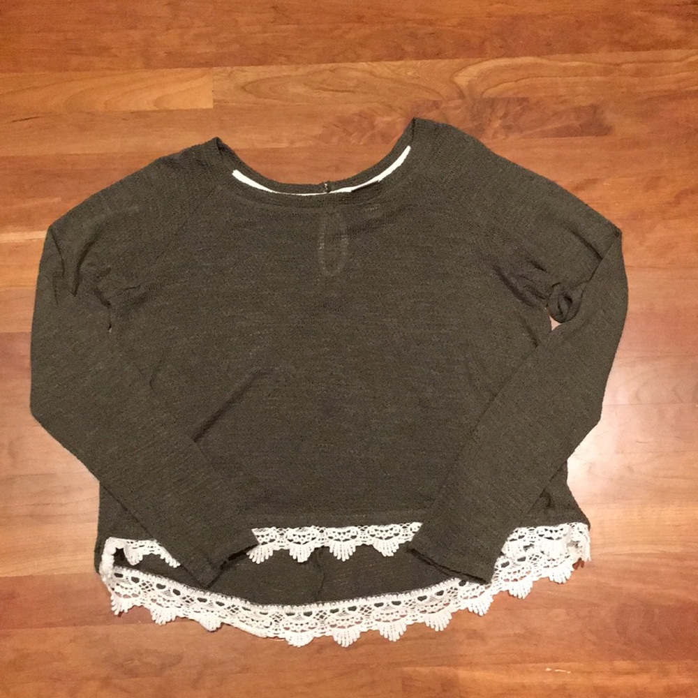 Green sweater.